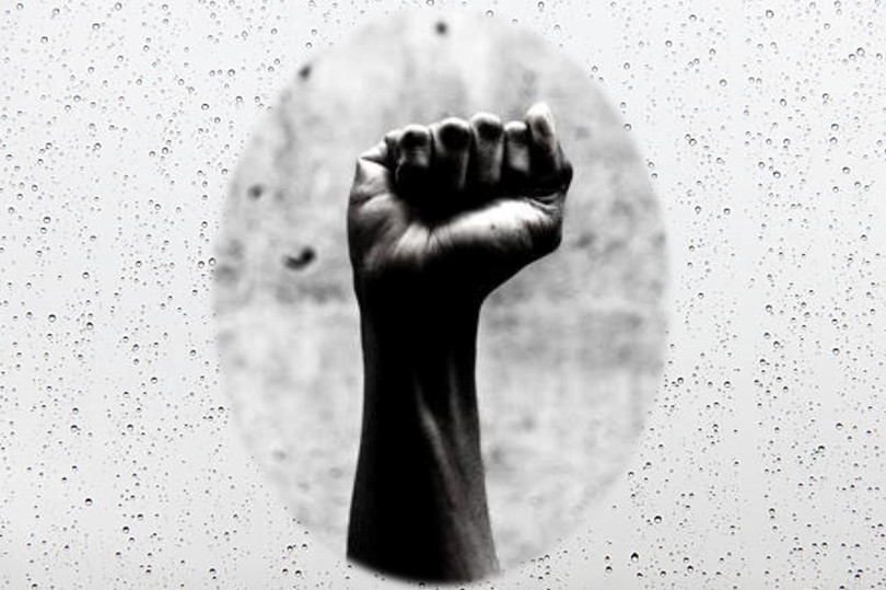 A black and white photo of a fist