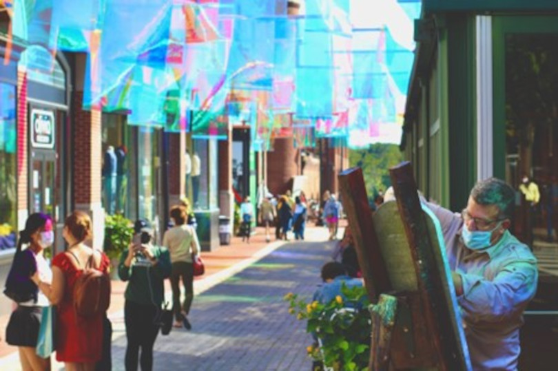 A street with many people walking on it