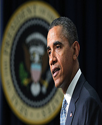 Barack Obama speaking at a podium.