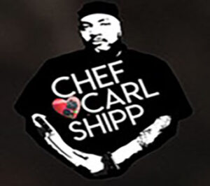 Chef Carl Shipp holding a knife.