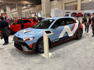 Sporty blue car at an auto show.