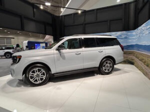 White SUV displayed at an exhibition.