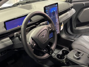 Modern car interior with digital displays.