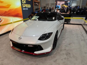 Nissan sports car displayed at auto show.