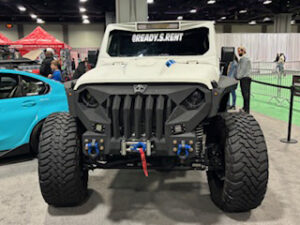 Custom off-road vehicle with oversized tires.