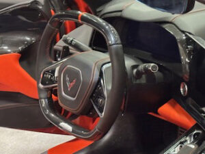 Corvette steering wheel with red accents.