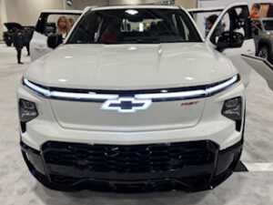 White Chevrolet truck at an auto show.