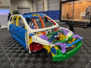 Colorful cutaway model of a car's structure.