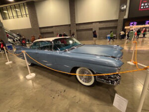 Classic blue vintage car on display.