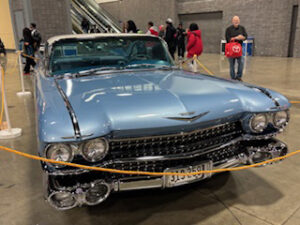 Classic blue vintage car on display.