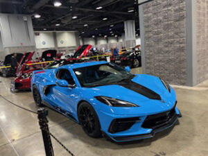 Blue sports car at an auto show.