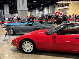 Classic cars displayed at an auto show.