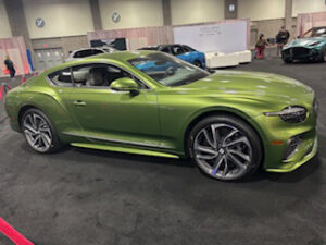 Green luxury sports car on display.