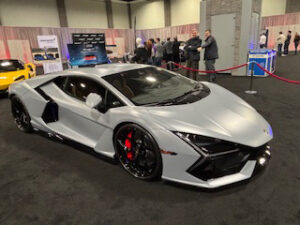 Silver sports car at an auto show.