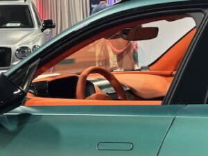 Luxury car interior with orange accents.