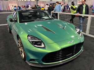 Luxury green sports car at event.