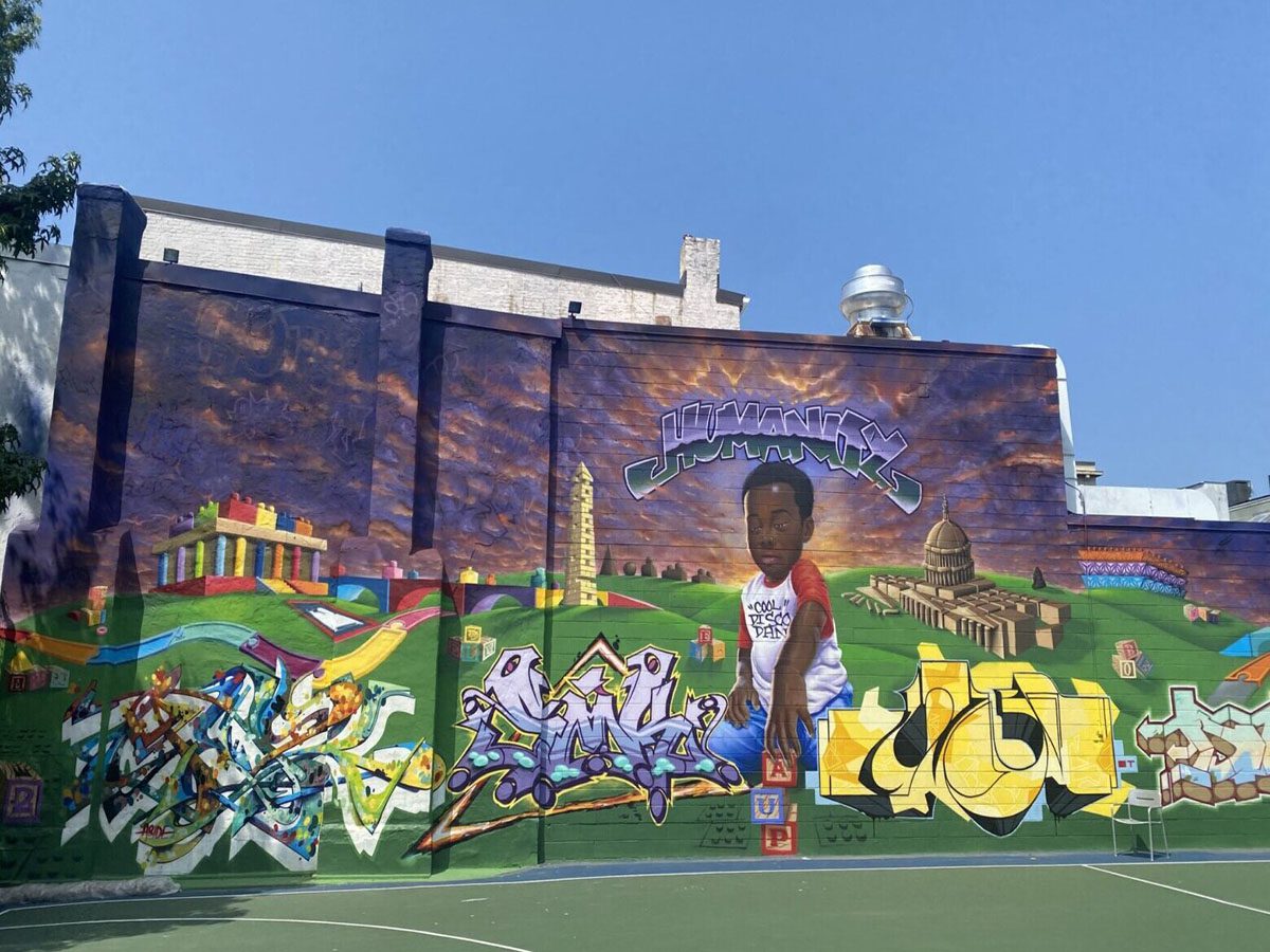 Colorful mural on urban building wall.