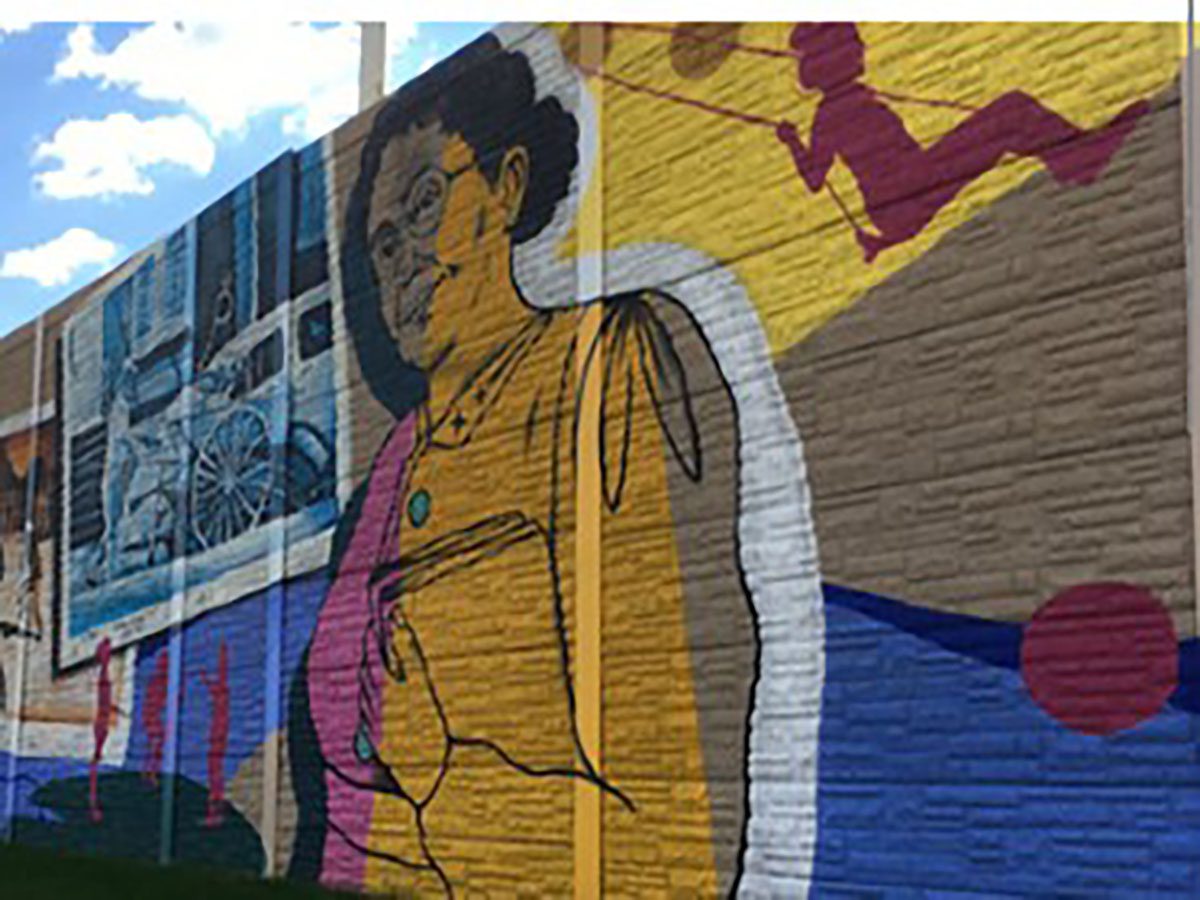 Colorful mural featuring historical figures and scenes.