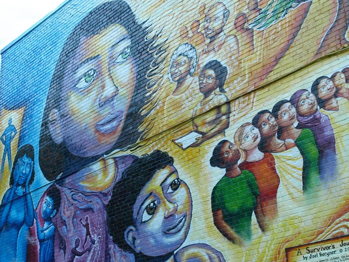 Colorful mural depicting diverse group of people.