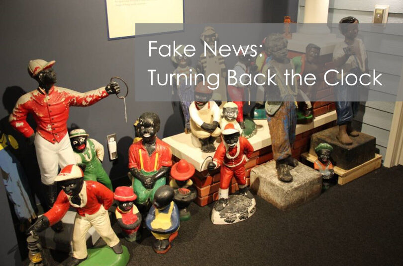 Racist caricature statues in a museum display.